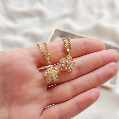 🌸 Bauhinia Zirkoon Ketting – Draaiend, Stijlvol en Sprankelend